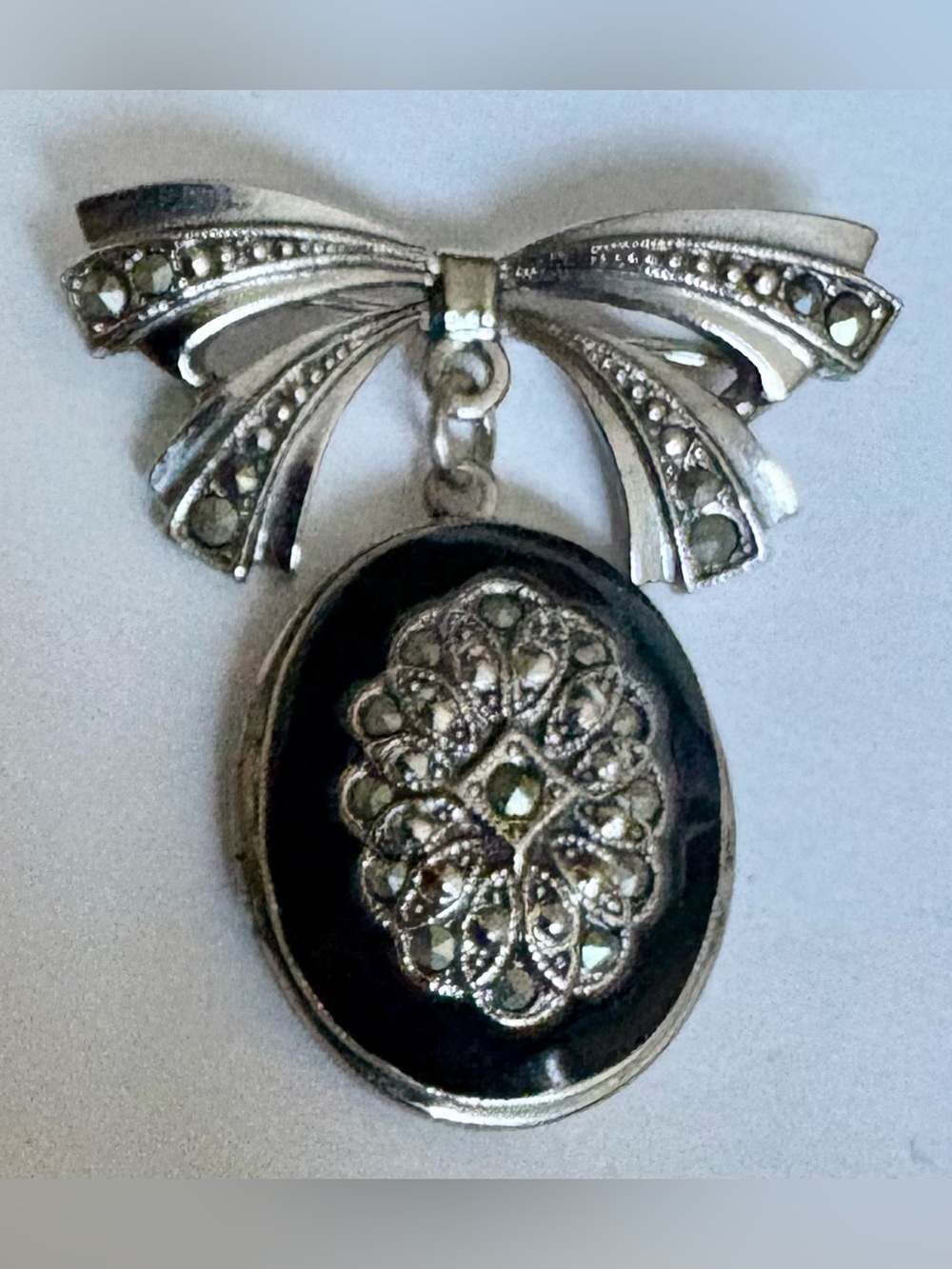 1928 Sterling silver bow brooch marcasite stones and black onyx locket pendant